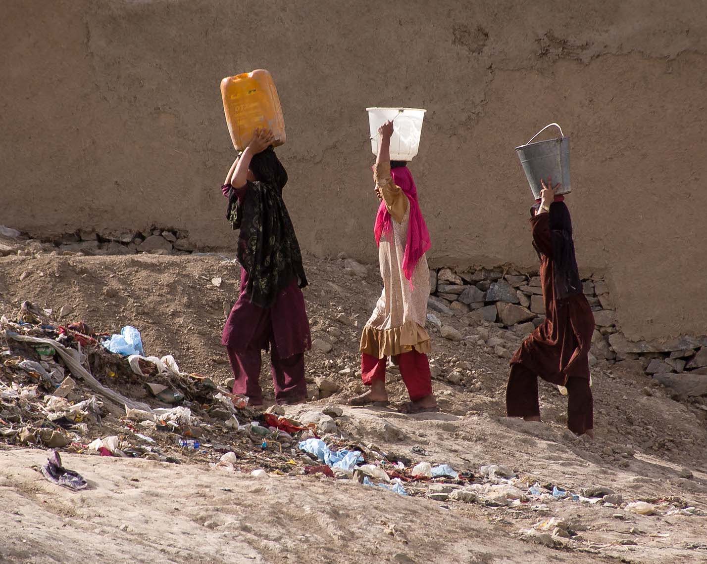 Women carrying water in Kabul, Afghanistan